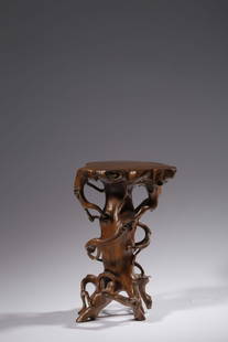 HUANGYANG BOXWOOD CARVED NATURALISTIC TREE STUMP SHAPED STAND: 清 黄杨木仿生根雕文房底座 Huangyang boxwood carved naturalistic tree stump shaped stand Height: 8 7/8 in (22.4 cm)