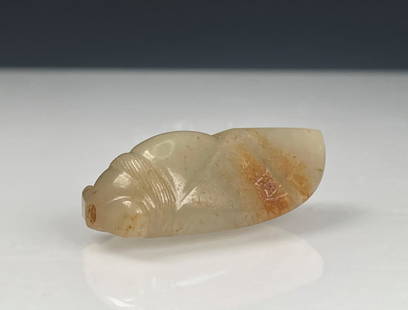 JADE CARVED 'CICADA' ORNAMENT: 玉蝉 Jade carved 'Cicada' ornament Height: 3/4 in (1.6 cm) Length: 1 7/8 in (4.5 cm) Width: 7/8 in (2.0 cm)