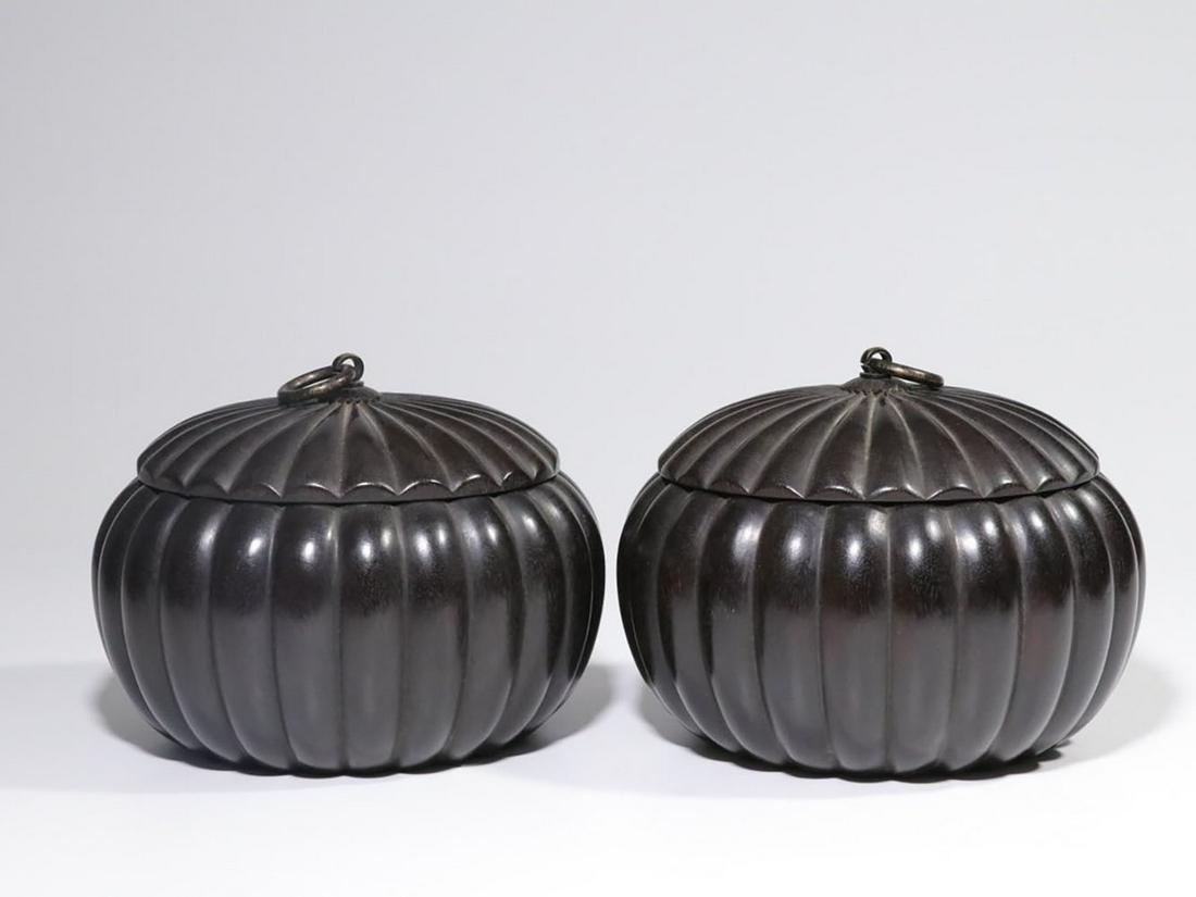 PAIR OF ZITAN WOOD CARVED MELON LOBED WEIQI JARS WITH LIDS: 小叶紫檀雕刻瓜棱形围棋罐一对 Pair of zitan wood carved melon lobed weiqi jars with lids Height: 4 5/8 in (11.5 cm) D