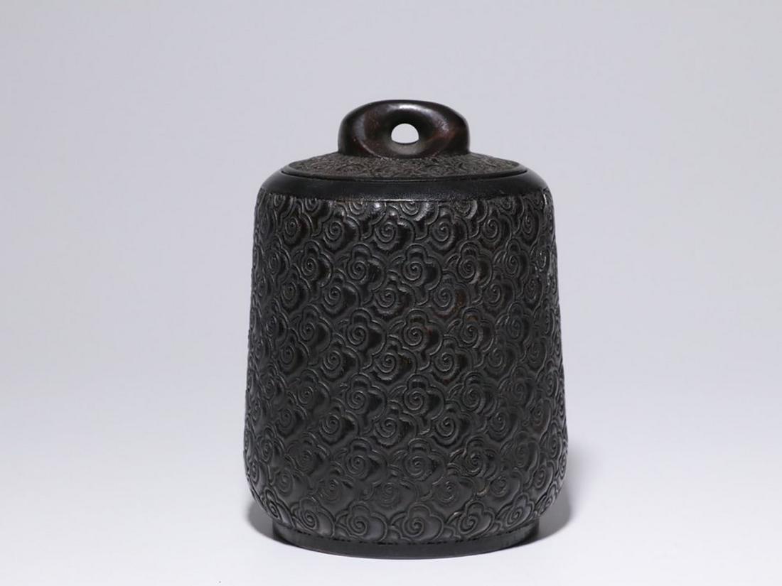 ZITAN WOOD CARVED 'RUYI CLOUDS' TEA JAR WITH LID: 小叶紫檀雕刻祥云纹饰秤砣形茶叶罐 Zitan wood carved 'Ruyi Clouds' tea jar with lid Height: 5 3/4 in (14.3