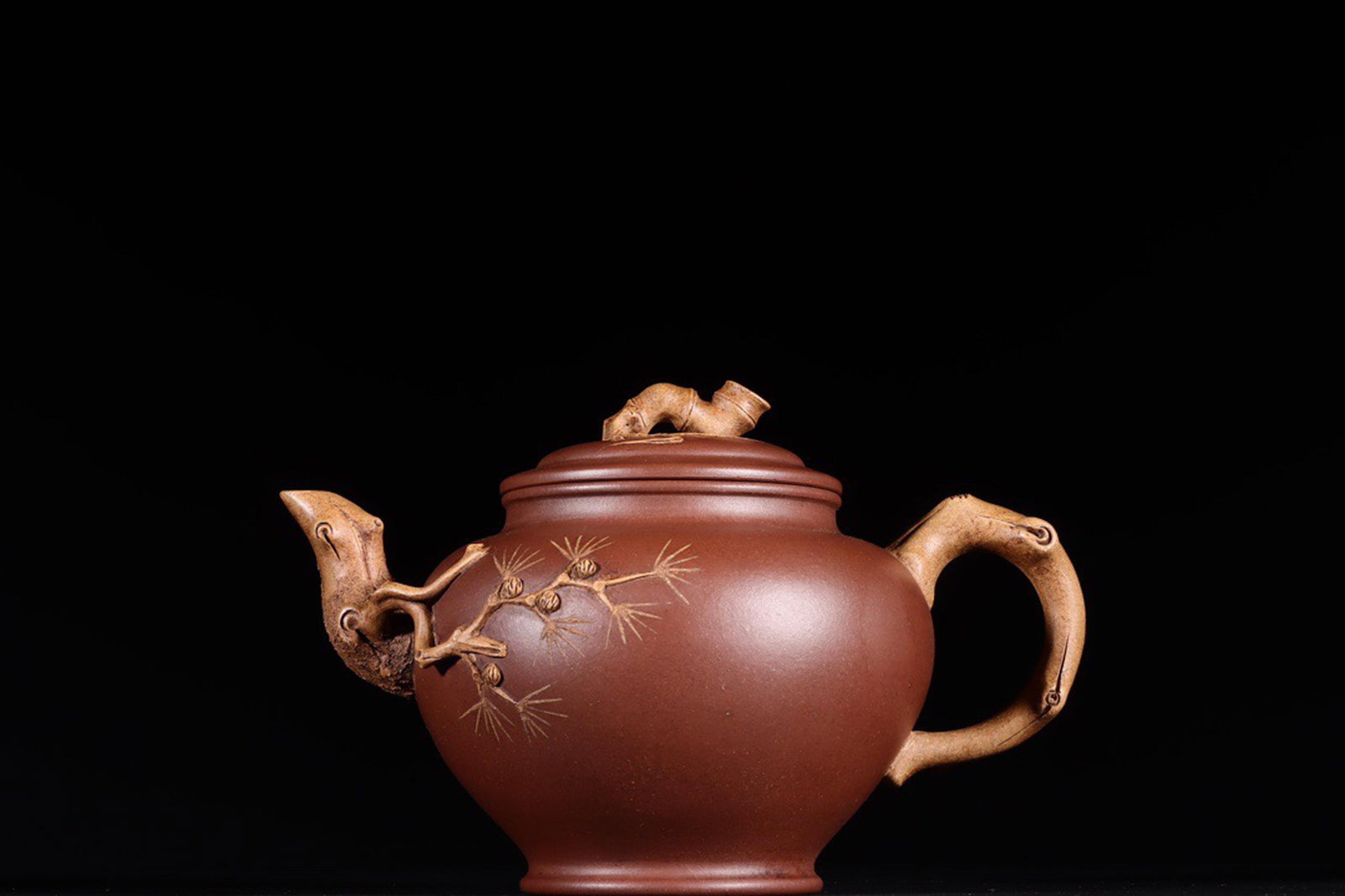 PINE, BAMBOO AND PLUM THREE PLANTS FRIENDS ZISHA TEAPOT WITH MARK OF ZHU KEXIN: 松竹梅三友紫砂壶 款识 朱可心 民国 Pine, bamboo and plum three plants friends Zisha teapot with mark of Zhu Kex