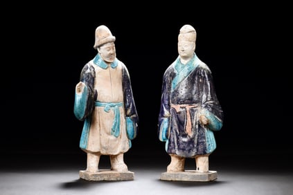 TWO CLAY AND PAINTED 'PERSON' FIGURES