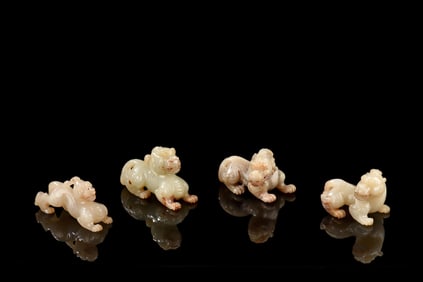 SET OF FOUR JADE CARVED 'PIXIU' FIGURE