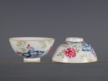 A PAIR OF FAMILLE ROSE FLOWER AND BIRD PATTERN CUPS MADE IN THE YEAR OF YONGZHENG IN THE QING