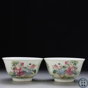 QING DYNASTY YONGZHENG YEAR. A PAIR OF CUPS WITH BOY CONGRATULATING BIRTHDAY PATTERN