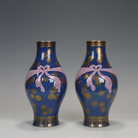 PAIR OF PINK ENAMEL BUNDLE BOTTLES