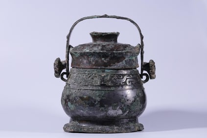 SHANG AND ZHOU BRONZE SHEEP-EAR HANDLE WINE BOTTLE