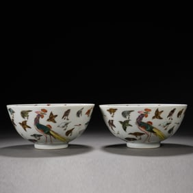 A PAIR OF PASTEL-COLORED BIRDS PAYING HOMAGE TO THE PHOENIX BOWLS