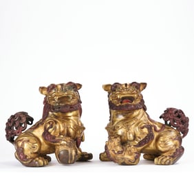 QING DYNASTY, A PAIR OF GILDED COPPER LIONS