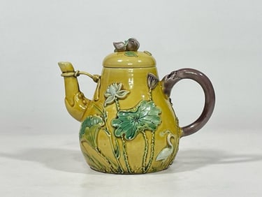 QING QIANLONG YEAR THREE-COLOR PILE CARVING AND BEAUTY PATTERN TEAPOT
