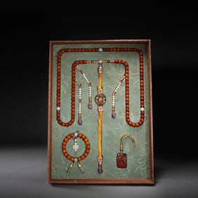 A SET OF QING DYNASTY BEESWAX COURT BEADS