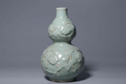 YUAN BLUE AND WHITE CARVED GOURD VASE
