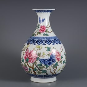 QING YONGZHENG YEAR BLUE AND WHITE PLUS FAMILLE ROSE BUTTERFLY LOVE PATTERN BOTTLE