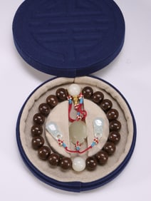 AGARWOOD DECORATED WITH HETIAN WHITE JADE SPACER BEADS AND 18 CHILDREN HOLDING ROSARY BEADS