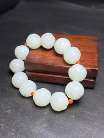 HETIAN JADE, MING AND QING DYNASTIES LOTUS HAND STRING
