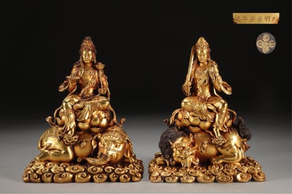 A PAIR OF MING YONGLE GILT BRONZE MANJUSHRI PUXIAN BODHISATTVA SITTING STATUES, THE UNIT WEIGHS