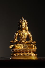 QING DYNASTY GILT BRONZE SITTING STATUE OF CHANGSHOU BUDDHA INLAID WITH TREASURES