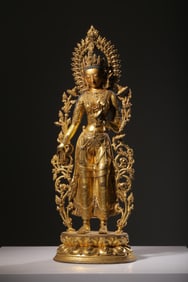 QING DYNASTY GILT BRONZE STANDING STATUE OF GUANYIN INLAID WITH TREASURES AND LOTUS