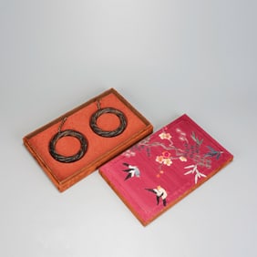 QING DYNASTY A PAIR OF AGARWOOD TWIST BRACELETS