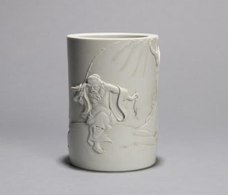 A CARVED FIGURE BRUSH POT