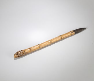 A PORCELAIN BAMBOO WRITING BRUSH