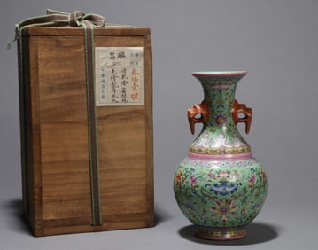 A GREEN-GROUND FLORAL VASE