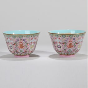 A PAIR OF PUCE-ENAMELED FAMILLE-ROSE FLORAL CUPS