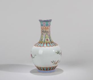 A FAMILLE-ROSE BIRD VASE