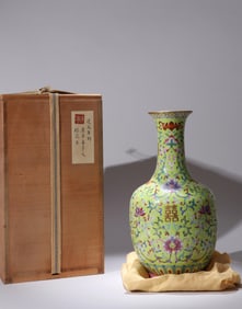 A YELLOW-GROUND FAMILLE-ROSE FLORAL VASE