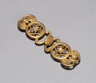 A GILT-COPPER BELT HOOK