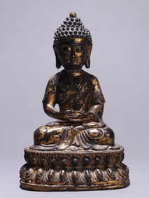 A GILT-BRONZE FIGURE OF SHAKYAMUNI BUDDHA