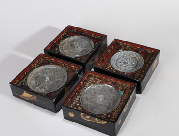 A GROUP OF FOUR COPPER MIRRORS