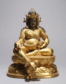 A GILT-COPPER ALLOY FIGURE OF JAMBHALA