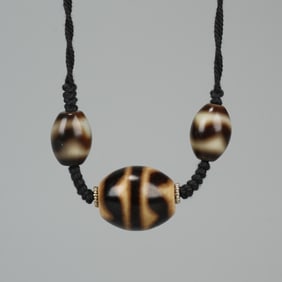TIGER TOOTH DZI BEAD NECKLACE