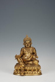 QING DYNASTY COPPER GILT TREASURE GOD SITTING STATUE