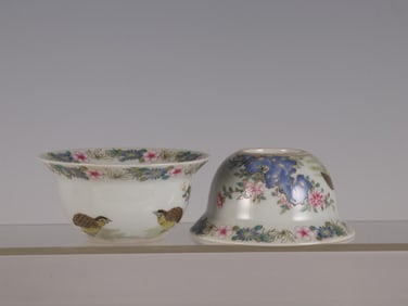 QIANLONG OF THE QING DYNASTY FAMILLE ROSE TO LIVE AND WORK IN PEACE AND CONTENTMENT CUPS PAIR
