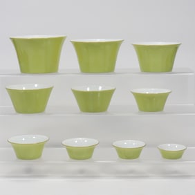 QING DYNASTY, TEN SETS OF LEMON YELLOW GLAZED HORSESHOE CUPS