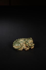 QING DYNASTY COPPER GILDED RECLINING BEAST