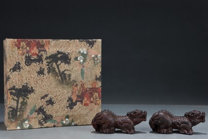 A PAIR OF SIZES OF OLD AGARWOOD CARVING MONSTERS