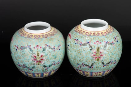 PAIR OF FAMILLE ROSE TURQUOISE GROUND 'SHOU' JARS WITH COVERS