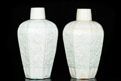 PAIR OF CELADON GLAZED AND CARVED VASES WITH COVERS