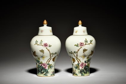 PAIR OF FAMILLE ROSE 'FLOWERS AND BUTTERFLIES' VASES WITH COVER