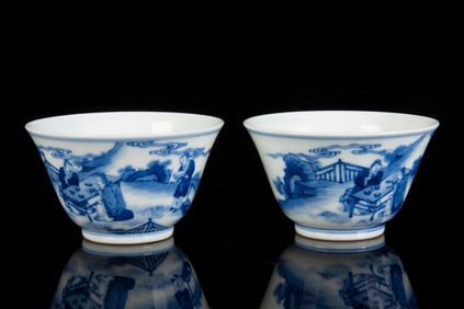 PAIR OF BLUE AND WHITE ?FIGURAL? CUPS