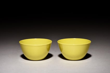 PAIR OF BRIGHT YELLOW MONOCHROME GLAZED CUPS