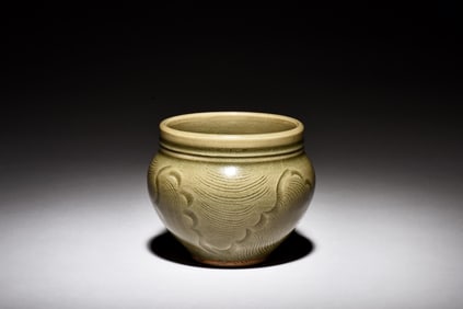 CELADON GLAZED AND CARVED JAR