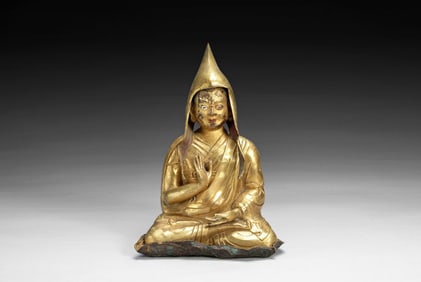 GILT BRONZE CAST 'LAMA' SEATED FIGURE