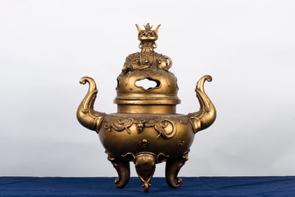 PARCEL GILT BRONZE CAST LARGE TRIPOD CENSER WITH ELEPHANT MASK HANDLES AND LID