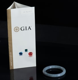 NATURAL GREYISH-WHITE TRANSLUCENT JADEITE BANGLE WITH GIA