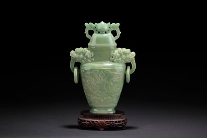 A CARVED JADE 'MYTHICAL BEAST' BOTTLE VASE