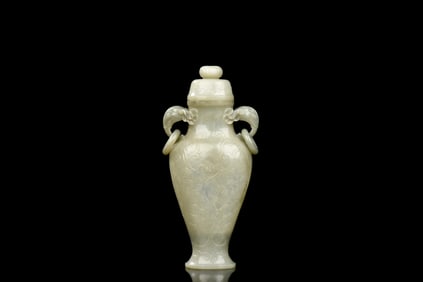 JADE CARVED BOTTLE VASE WITH ELEPHANT MASK HANDLES AND LID
